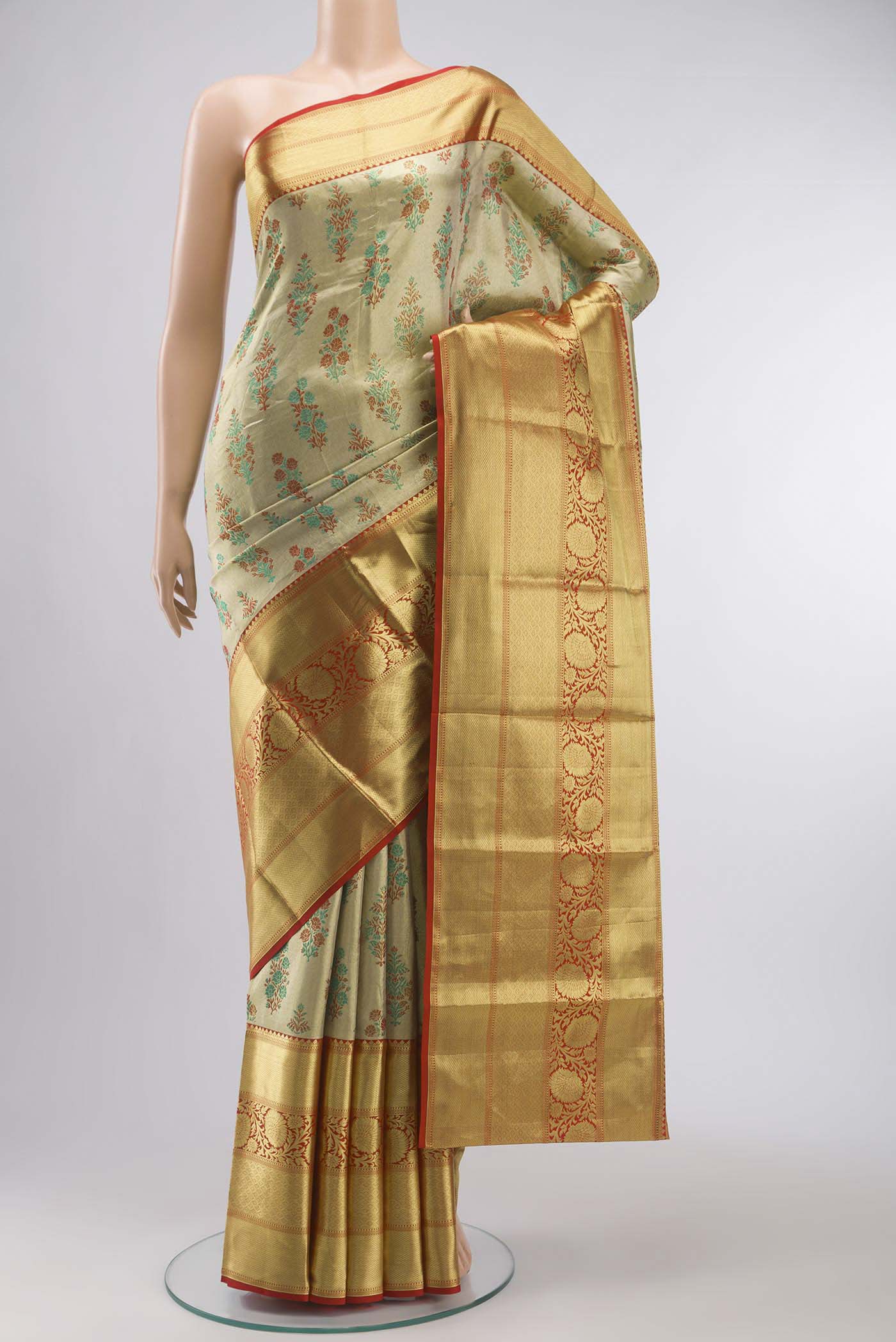 Gold with Red Color Kanchipuram Tissue Silk Saree with Zari Brocade on the body and Zari Border displayed on a mannequin