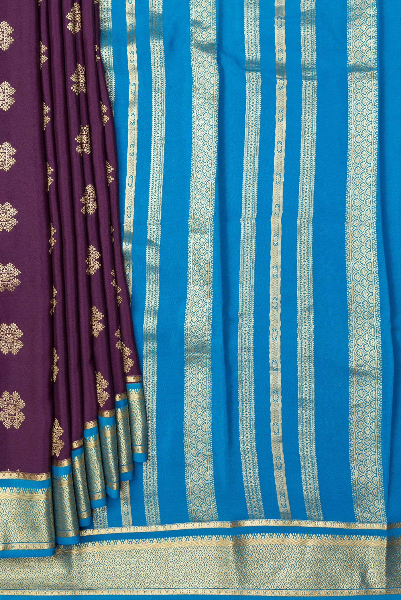Pleats and pallu of Burgundy Dual Tone Mysore Silk Saree with Zari Butta on the body and Zari Border. 
