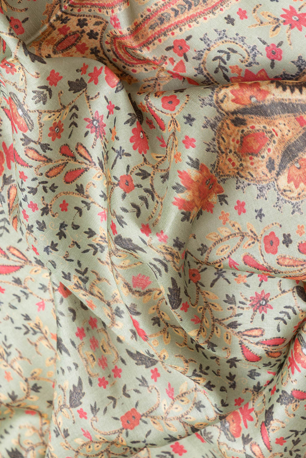 Close up of Pista Green Dual Tone Tussar Silk Saree with Printed design on the body and Printed Border.  displaying folds