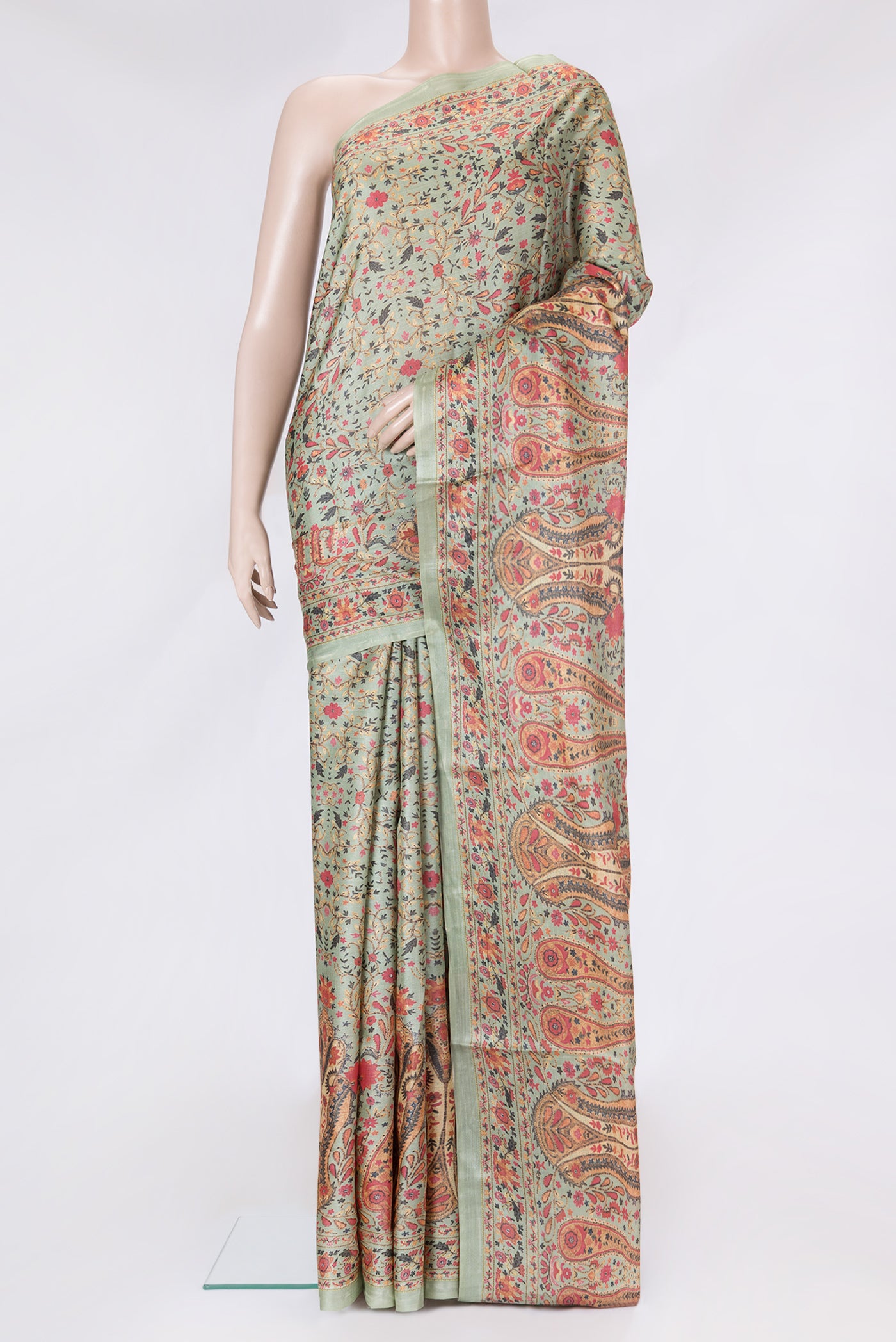 Pista Green Dual Tone Tussar Silk Saree with Printed design on the body and Printed Border.  displayed on a mannequin