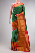 Green Kanjivaram Silk Saree with Zari Brocade on the body and Zari Border.  displayed on a mannequin