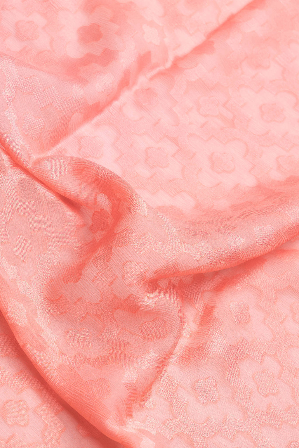 Close up of Golden Peach Dual Tone Georgette Saree with Jacquard design on the body and Zari Border.  displaying folds