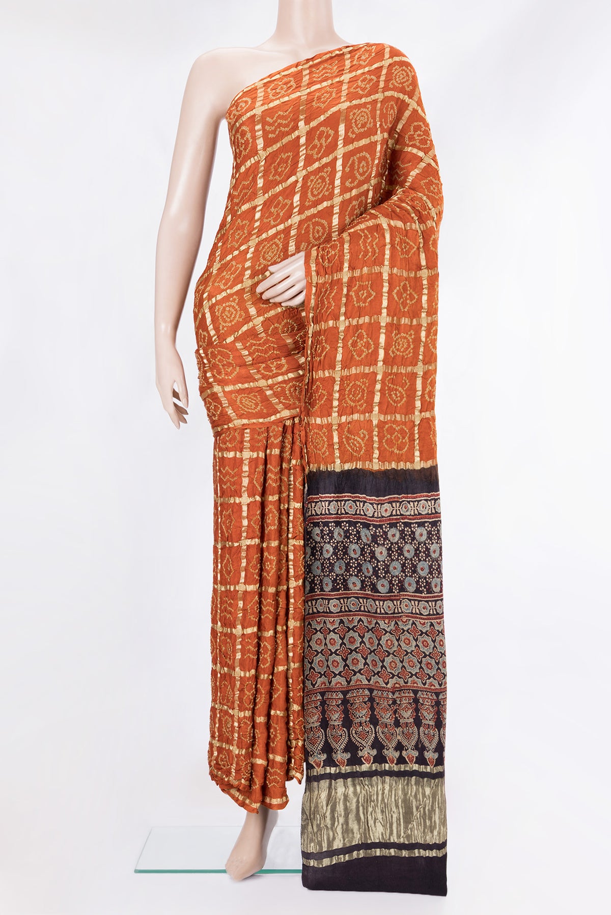 Pure Silk Orange Bandhani Saree with Bandhani on the body and Without Border.  displayed on a mannequin