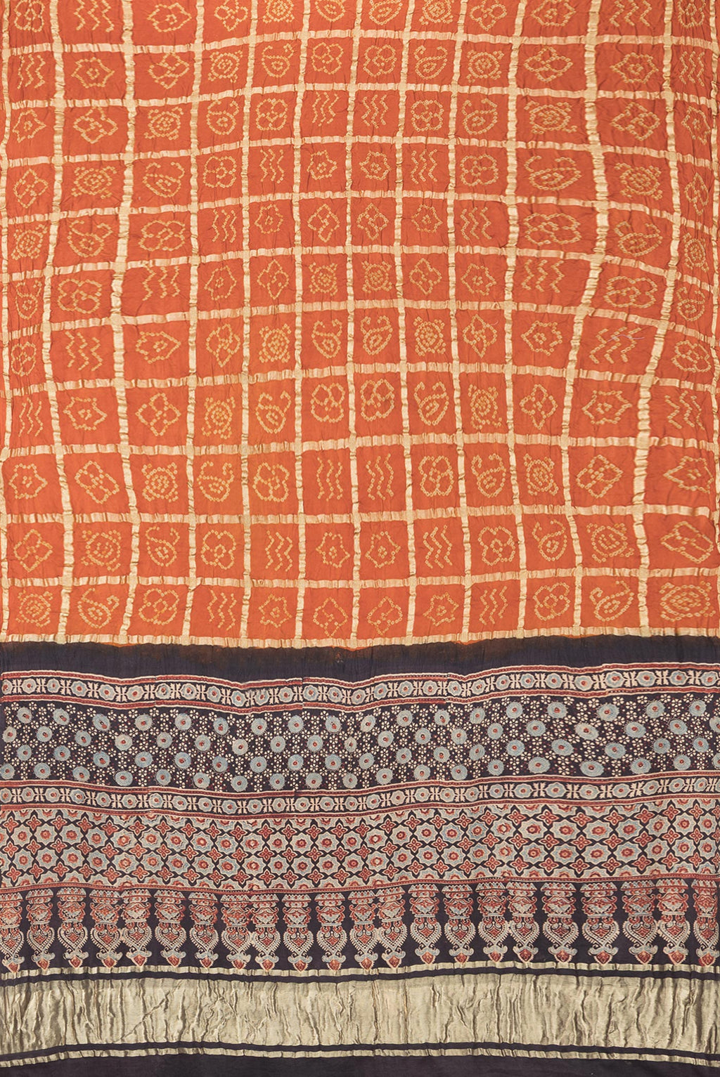 Flat view of Pure Silk Orange Bandhani Saree with Bandhani on the body and Without Border. 