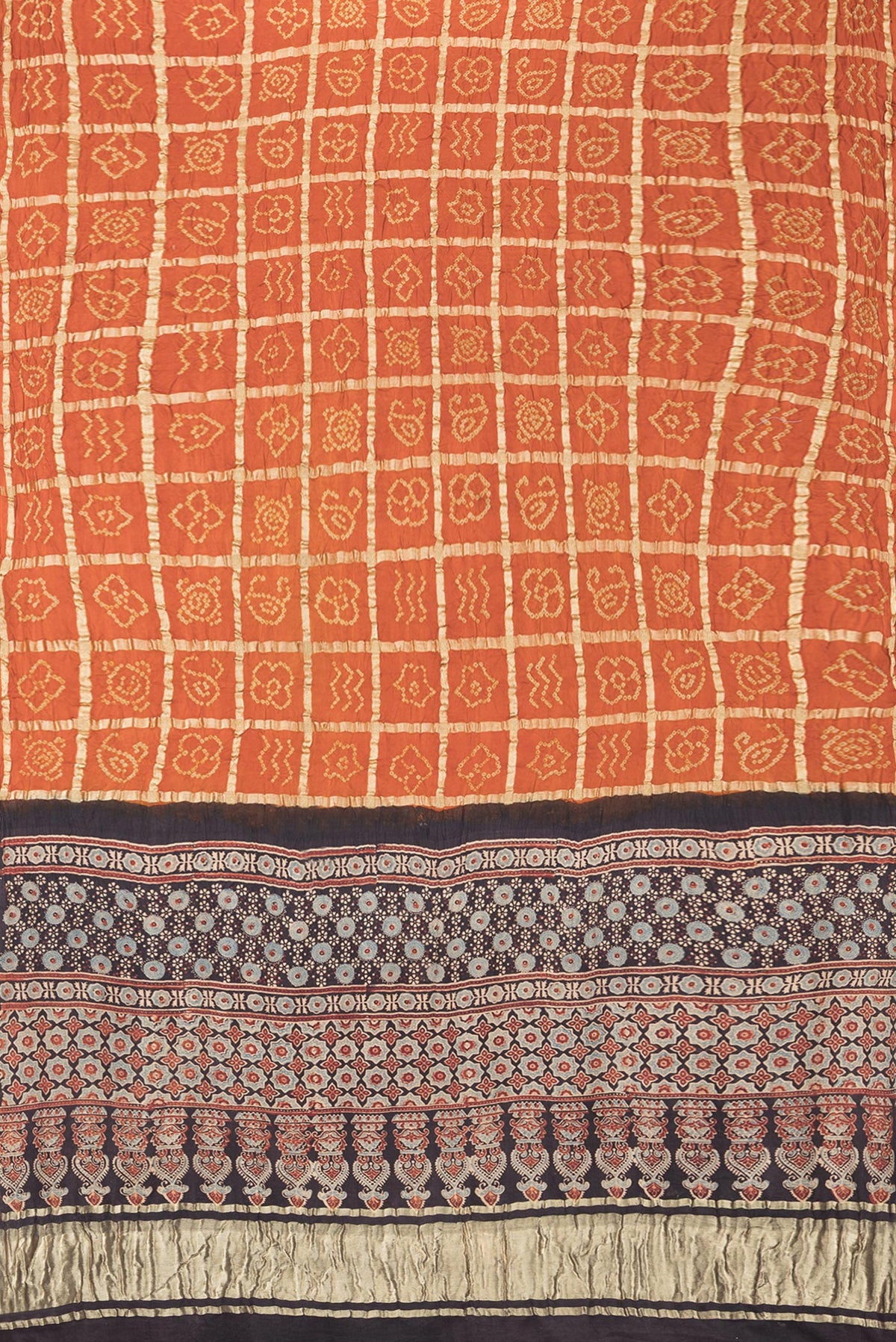 Flat view of Pure Silk Orange Bandhani Saree with Bandhani on the body and Without Border. 