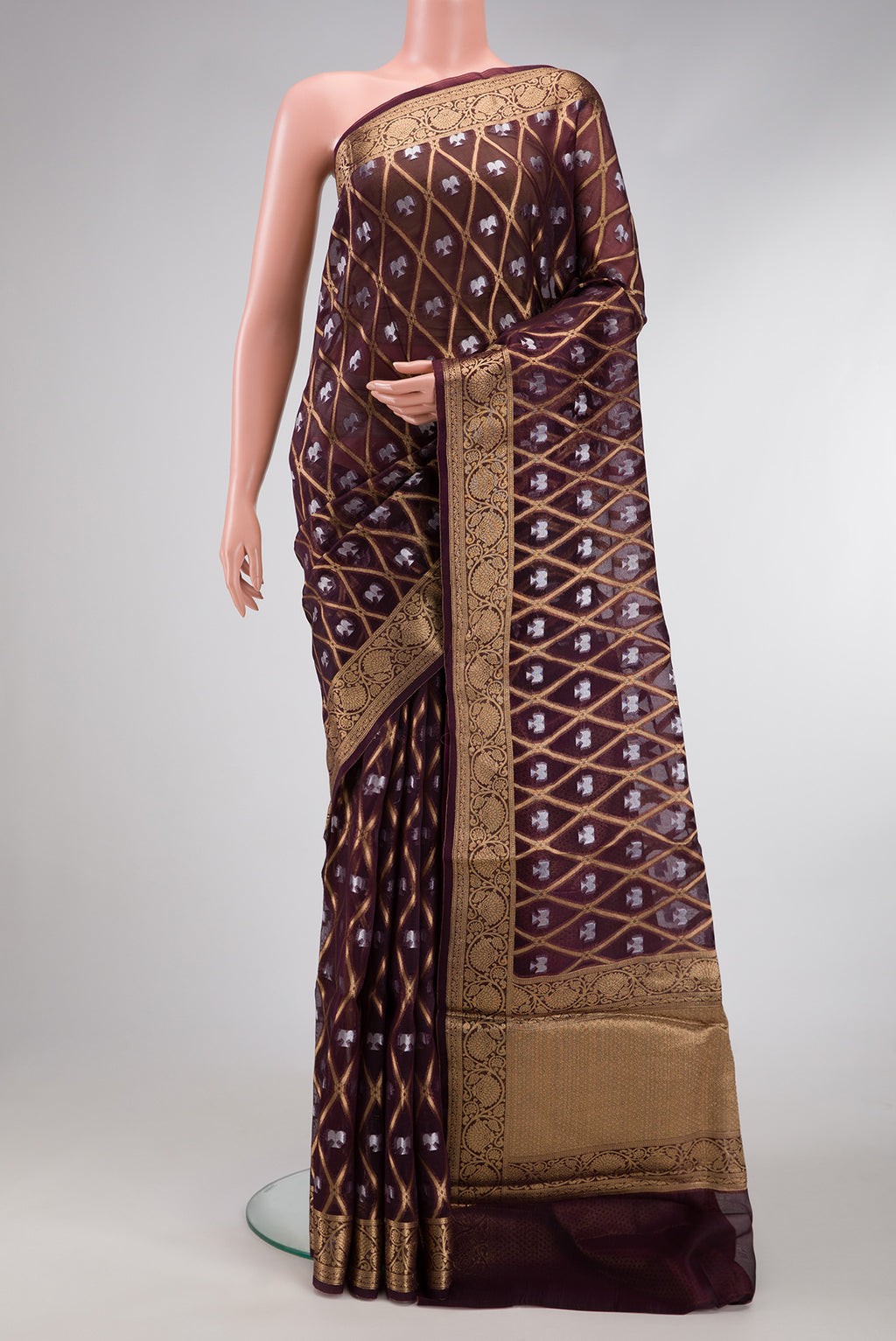 Coffee Brown Dual Tone Organza Silk Saree with Printed design on the body and Zari Border.  displayed on a mannequin