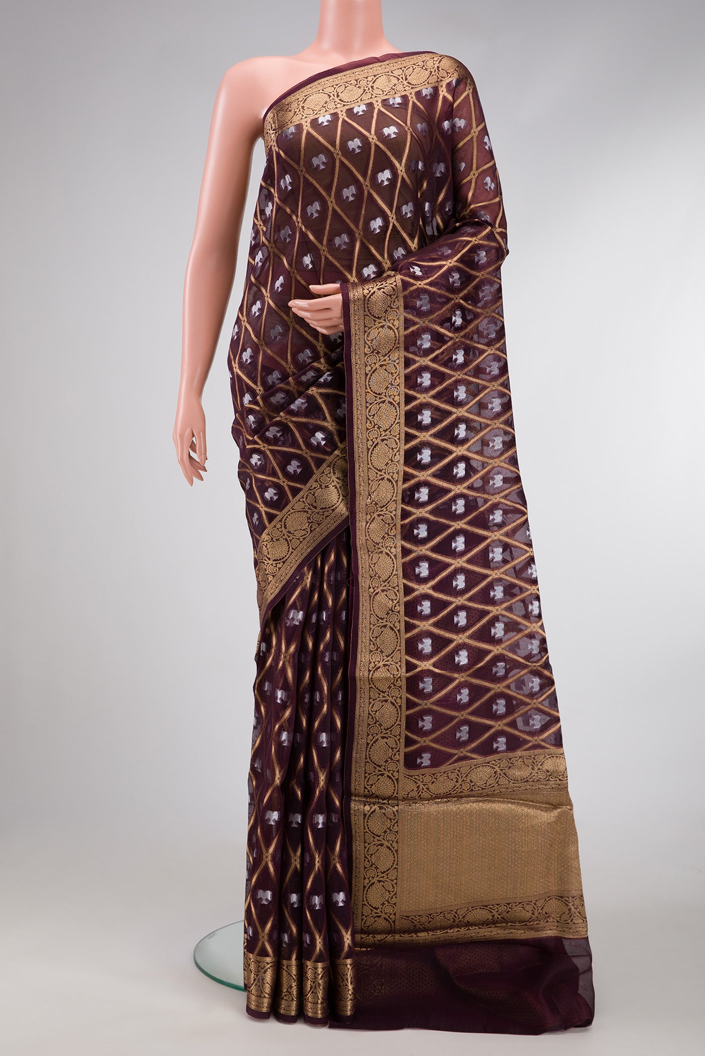 Coffee Brown Dual Tone Organza Silk Saree with Printed design on the body and Zari Border.  displayed on a mannequin