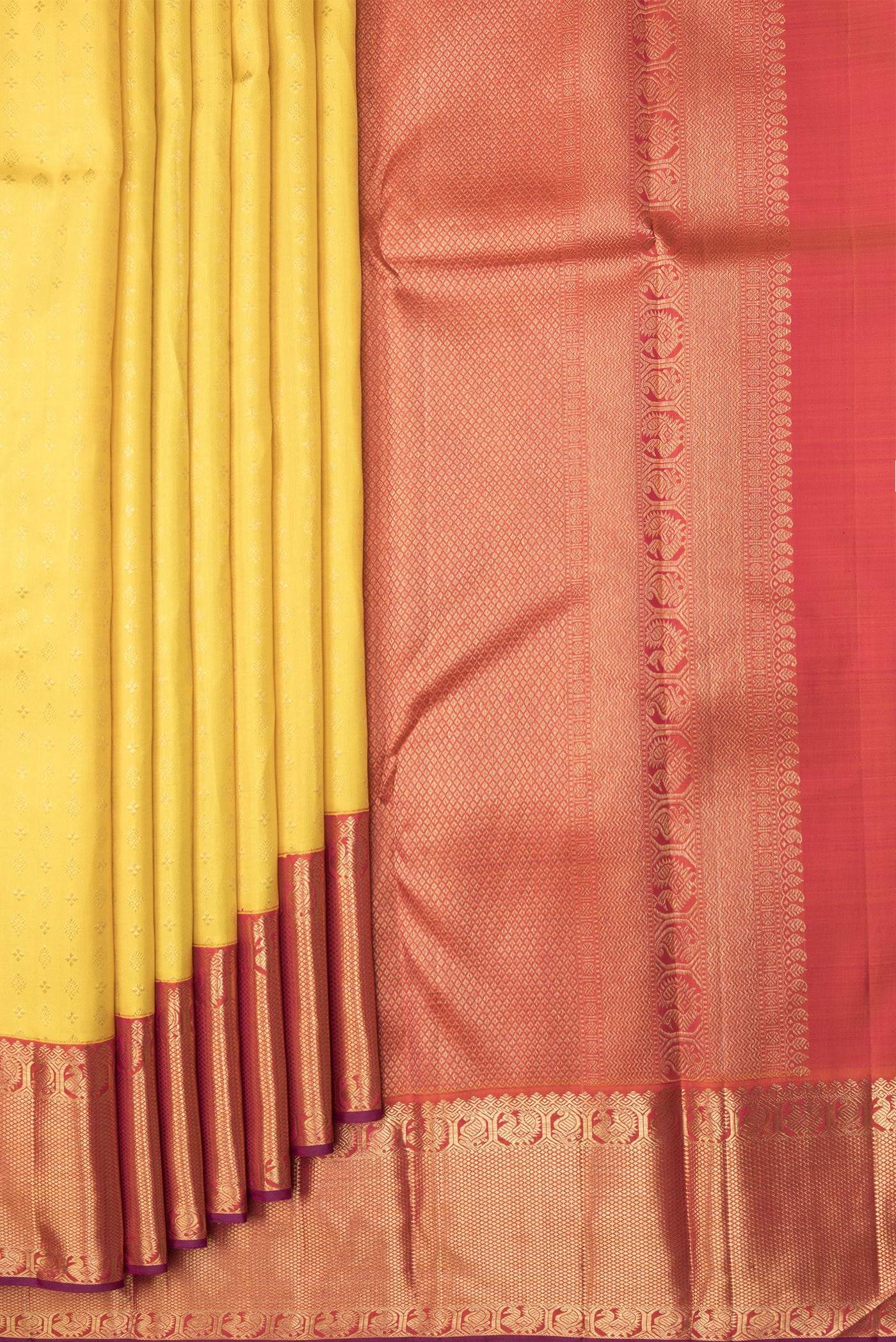 Pleats and pallu of Yellow Dual Tone Kanjivaram Silk Saree with Zari Brocade on the body and Zari Border. 