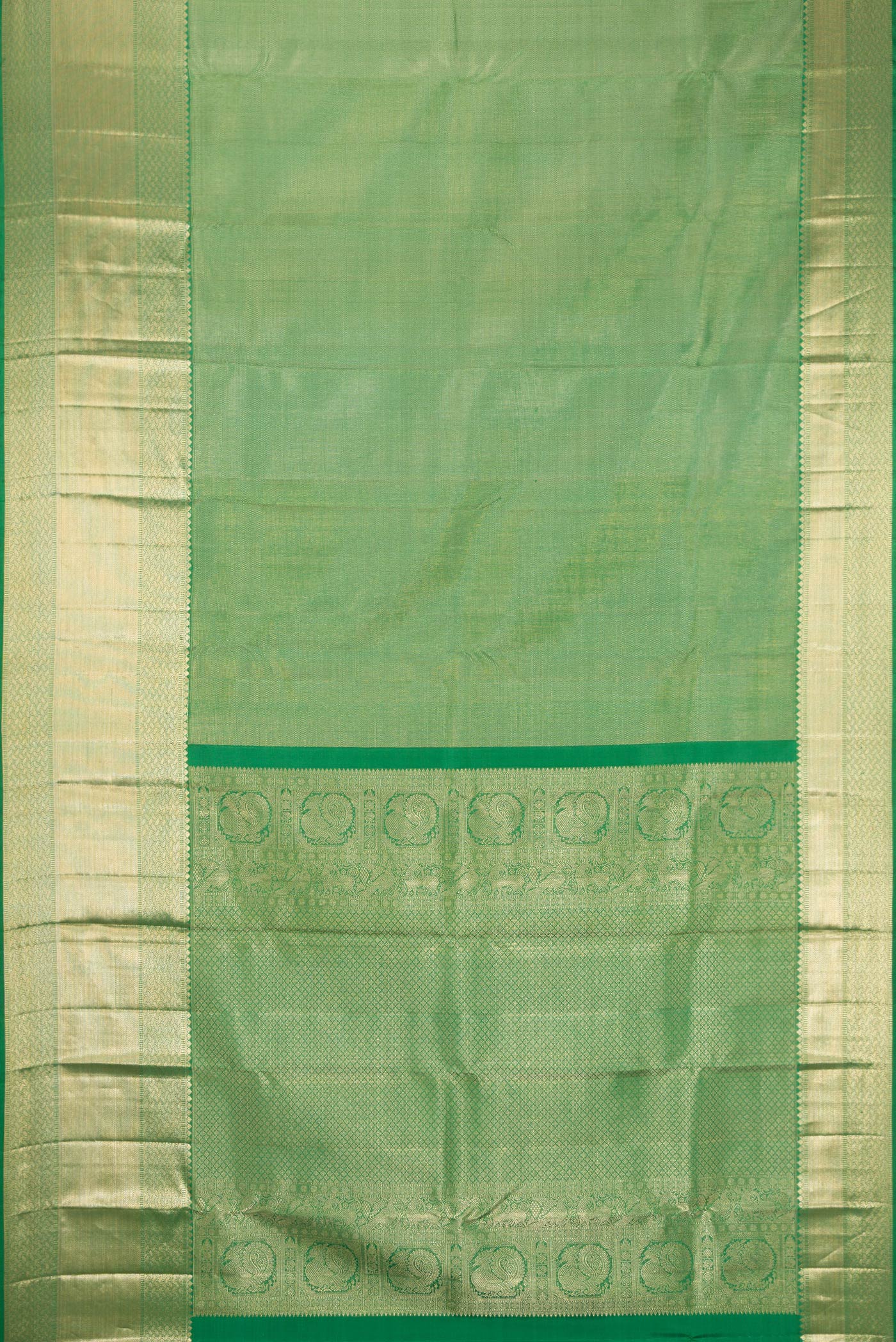 Flat view of Pista Green Dual Tone Kanchipuram Silk Saree with Zari Brocade on the body and Zari Border. 