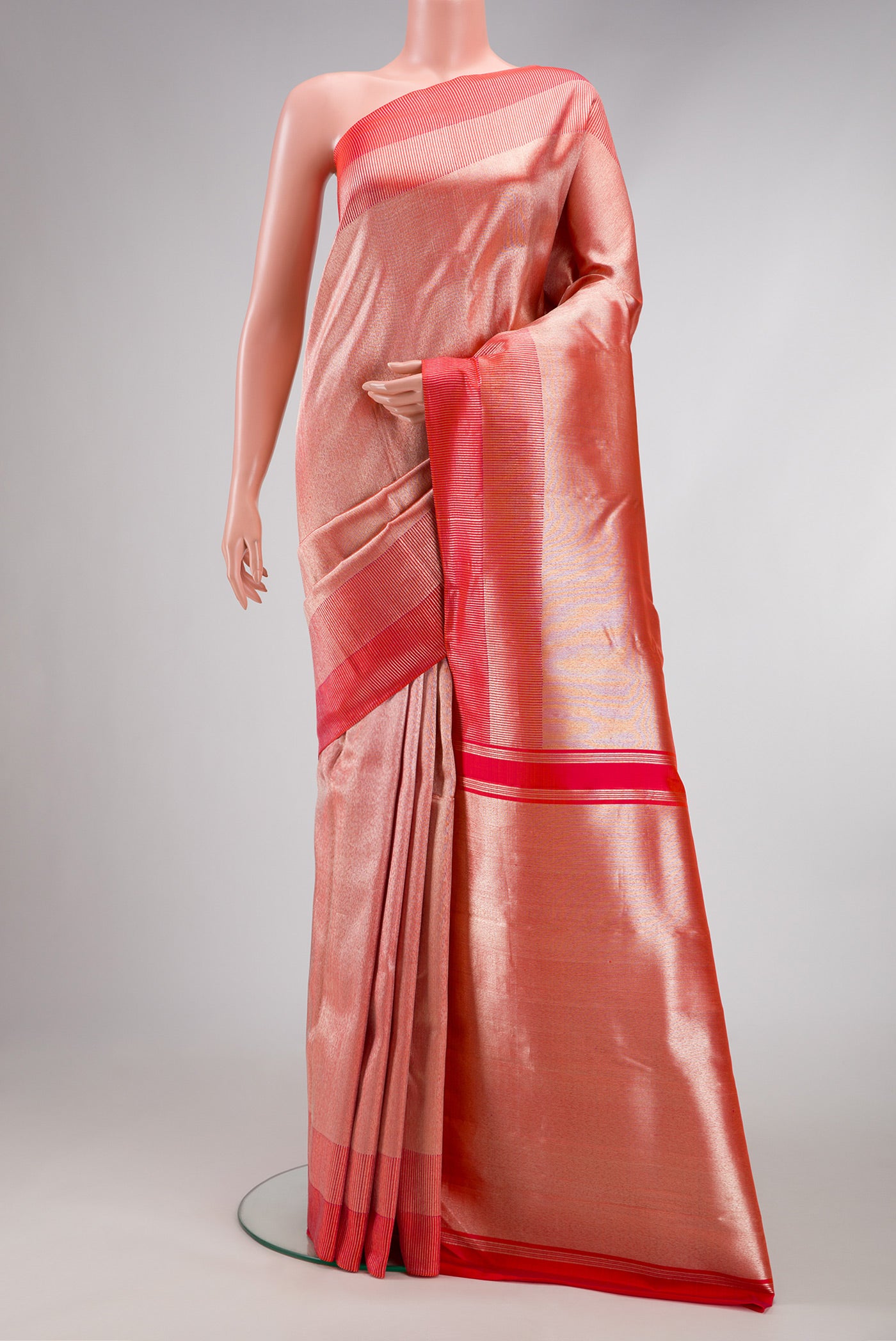 Coral Dual Tone Kanchipuram Silk Saree with Zari Brocade on the body and Fancy Border.  displayed on a mannequin