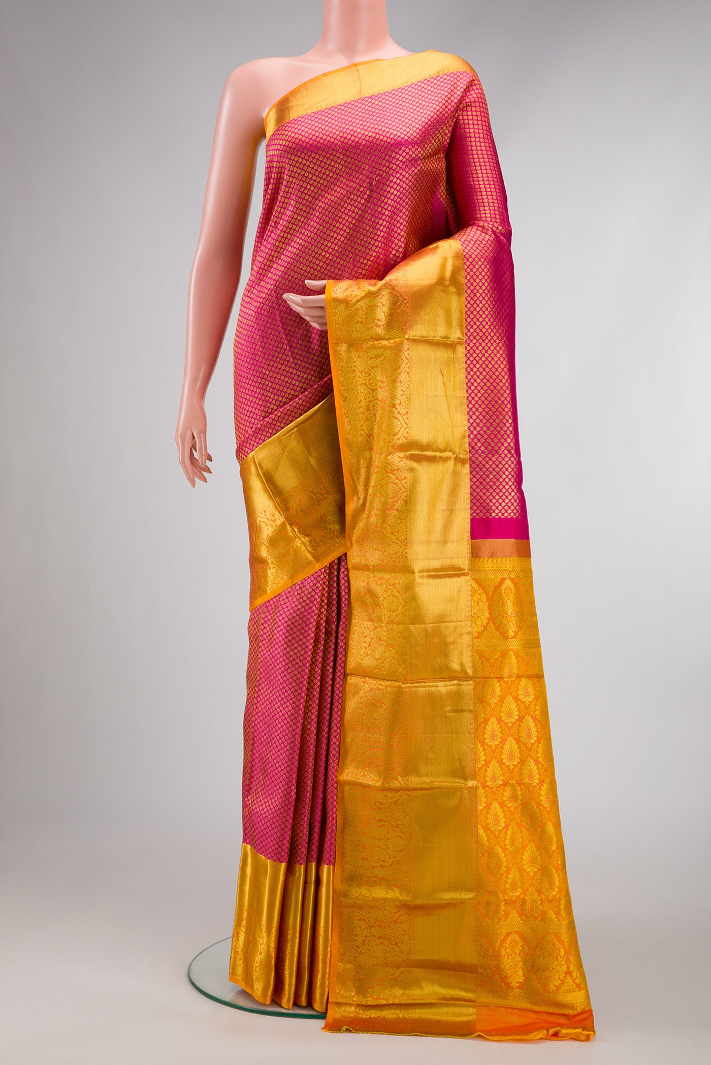 Pink Dual Tone Kanchipuram Silk Saree with Zari Brocade on the body and Zari Border.  displayed on a mannequin
