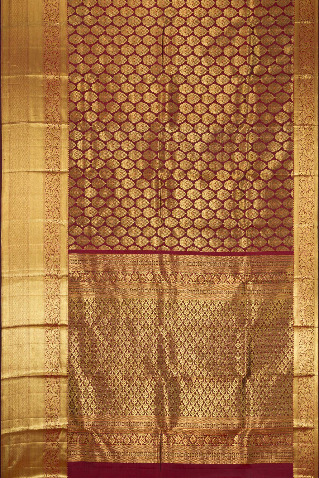 Flat view of Maroon Dual Tone Kanjivaram Silk Saree with Zari Brocade on the body and Zari Border. 