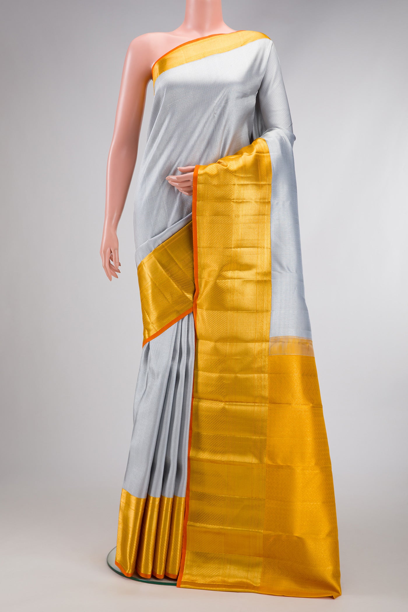 Grey Dual Tone Kanchipuram Silk Saree with Zari Brocade on the body and Zari Border.  displayed on a mannequin