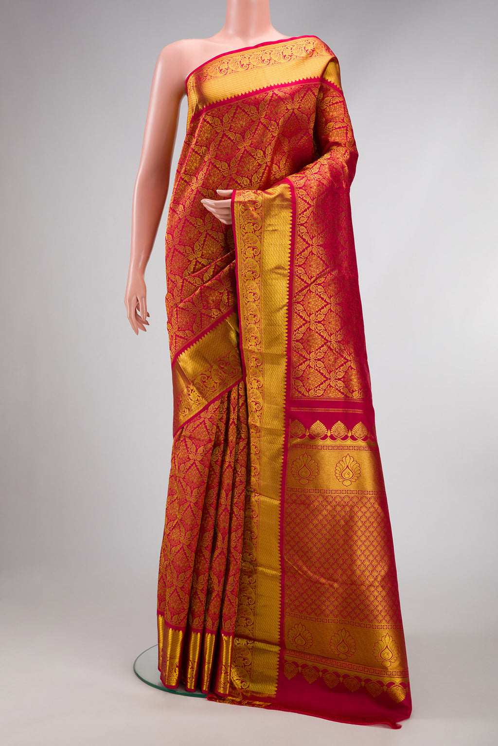 Maroon Dual Tone Kanjivaram Silk Saree with Zari Brocade on the body and Zari Border.  displayed on a mannequin