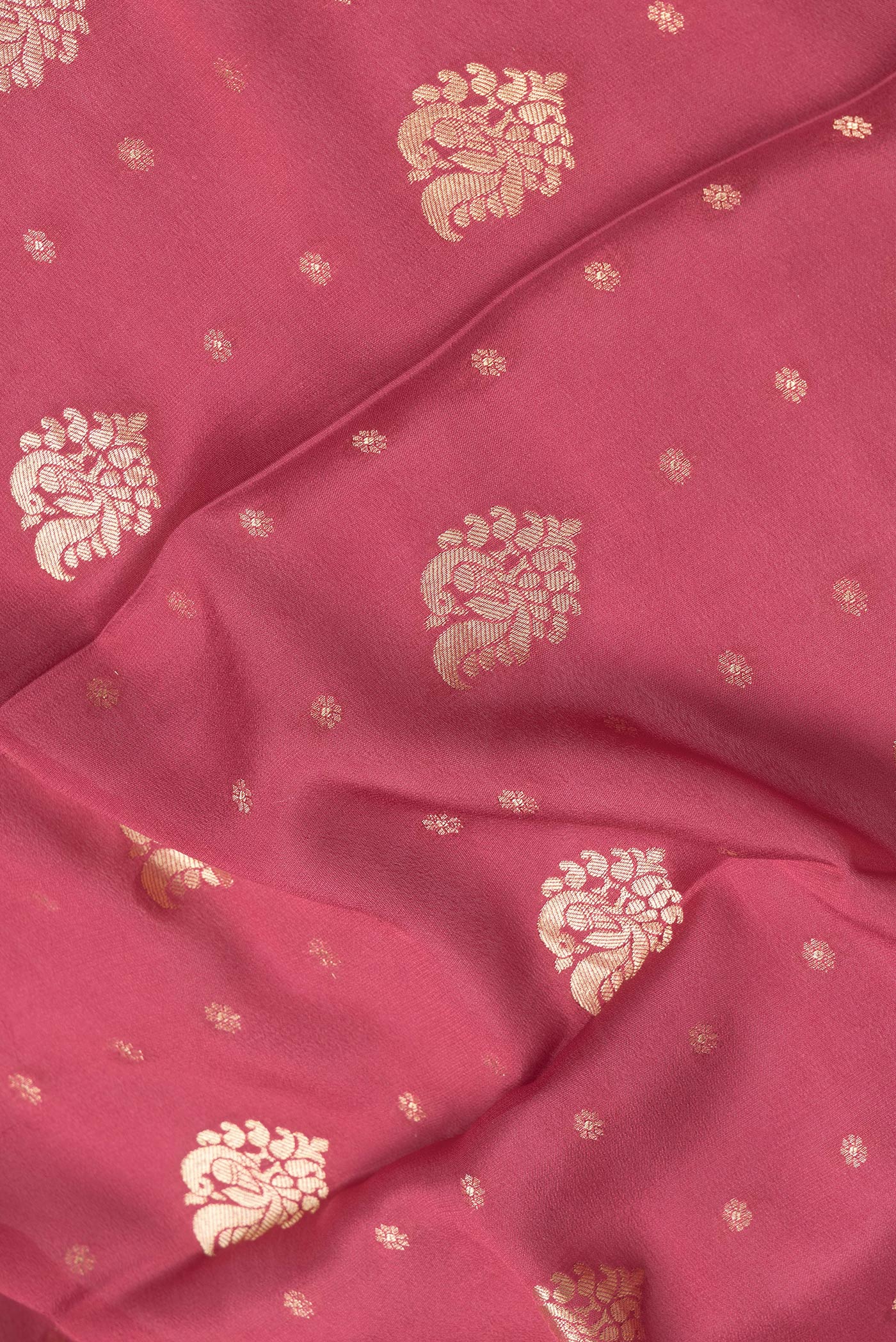 Close up of Pink Dual Tone Mysore Georgette Saree with Zari Butta on the body and Zari Border.  displaying folds