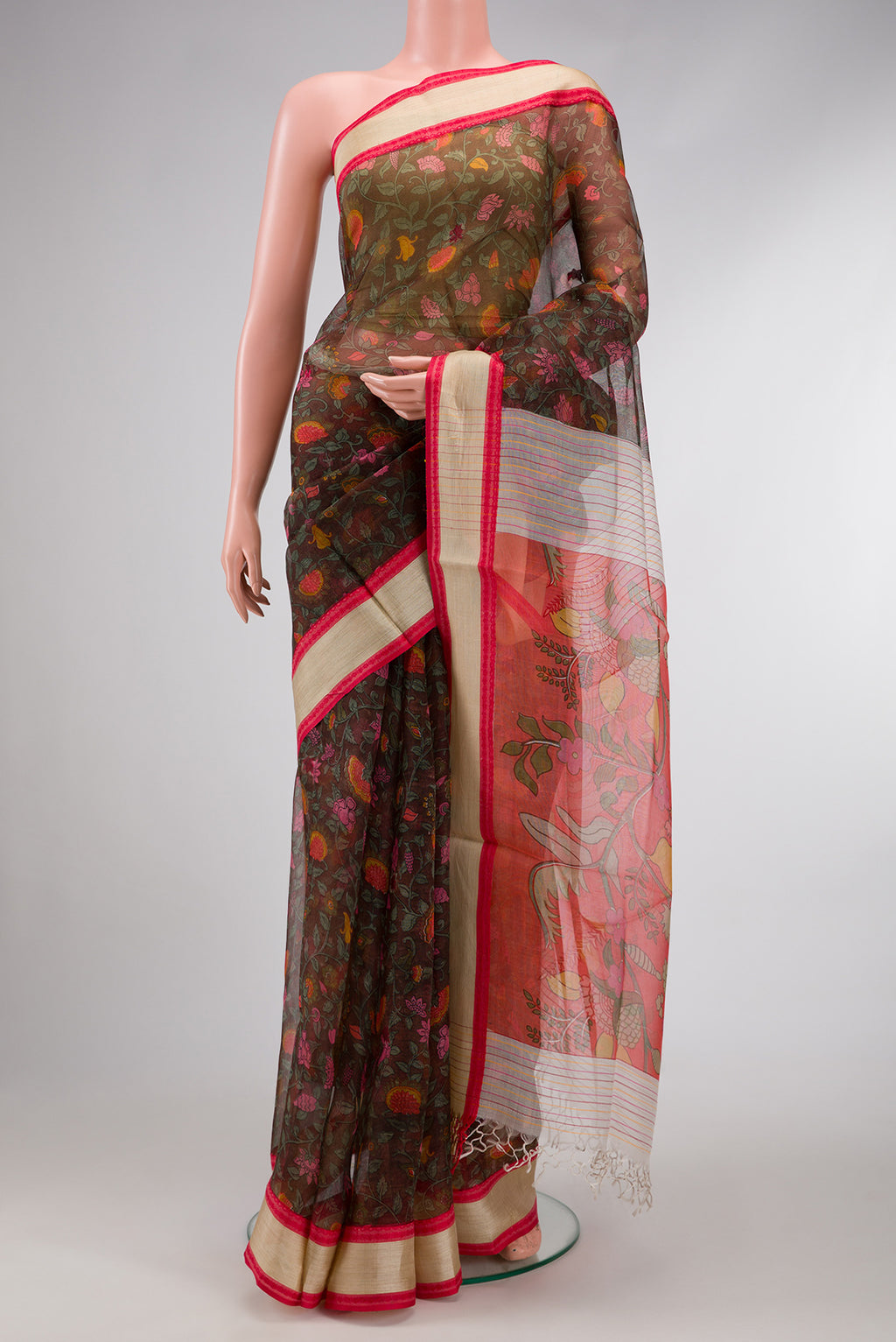 Bottle Green Dual Tone Organza Silk Saree with Printed design on the body and Thread Border.  displayed on a mannequin