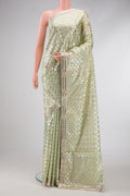 Pista Green Dual Tone Organza Silk Saree with Zari Brocade on the body and Embroidery Border.  displayed on a mannequin