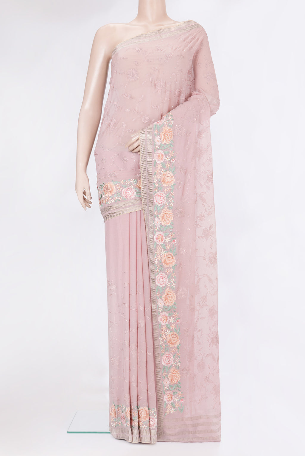 Rose Gold Chiffon Saree with Embroidery on the body and Embroidery Border.  displayed on a mannequin
