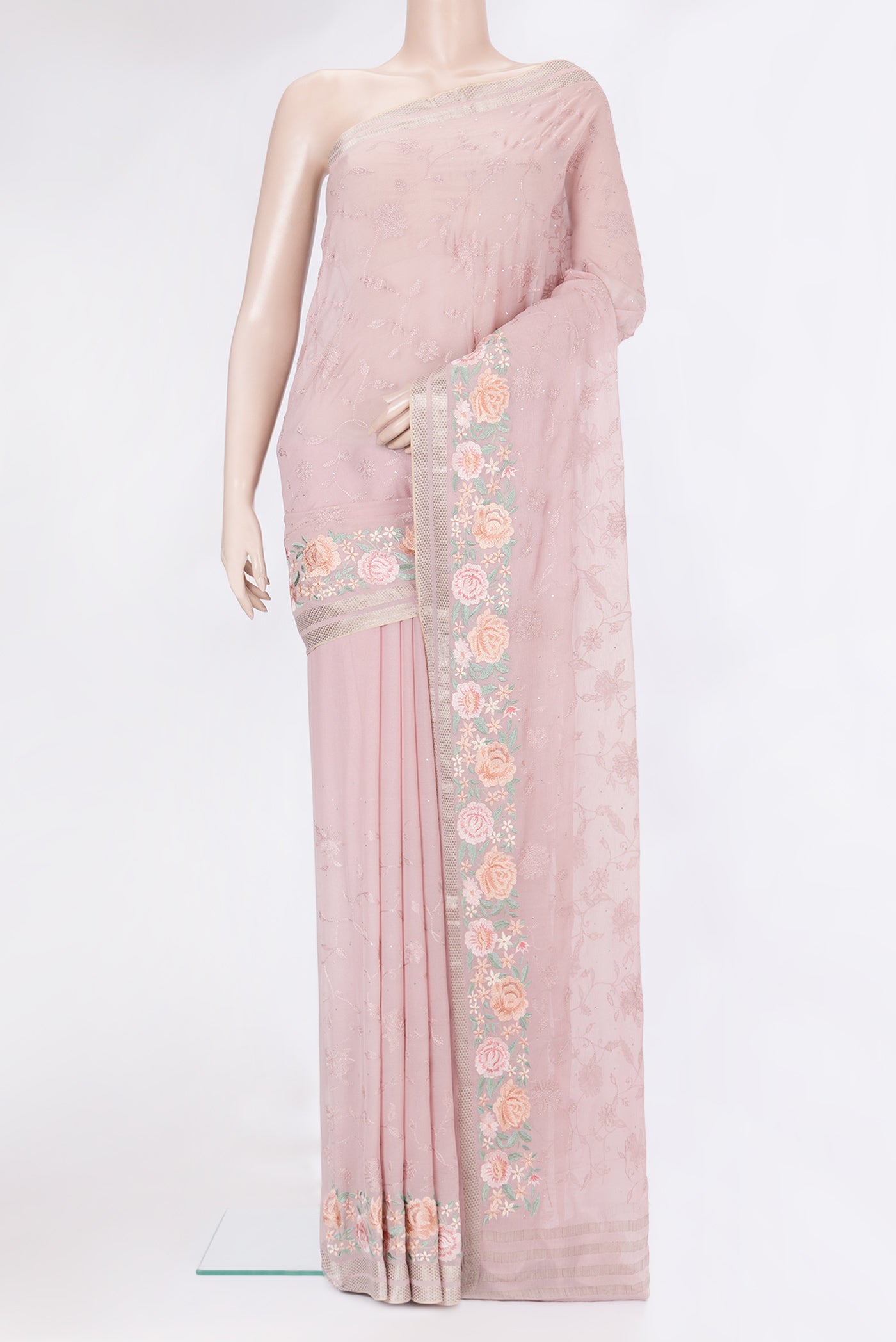 Rose Gold Chiffon Saree with Embroidery on the body and Embroidery Border.  displayed on a mannequin