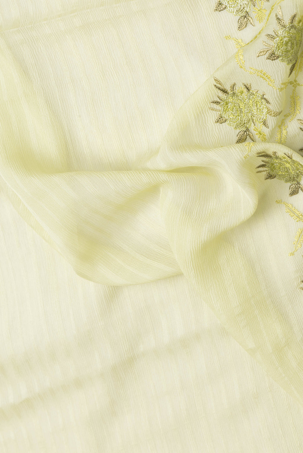 Close up of Pista Green Dual Tone Mysore Chiffon Saree with Stripes on the body and Embroidery Border.  displaying folds