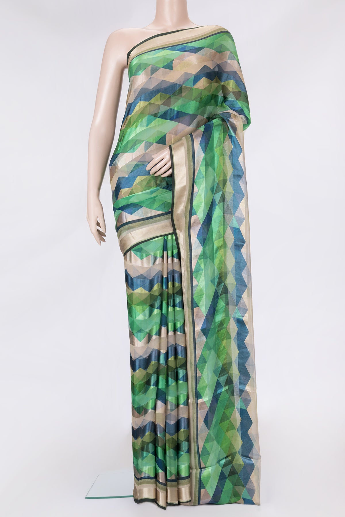 Green Dual Tone Mysore Crepe Saree with Printed design on the body and Zari Border.  displayed on a mannequin
