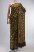 Green Satin Silk Saree with Abstract Print on the body and Printed Border displayed on a mannequin