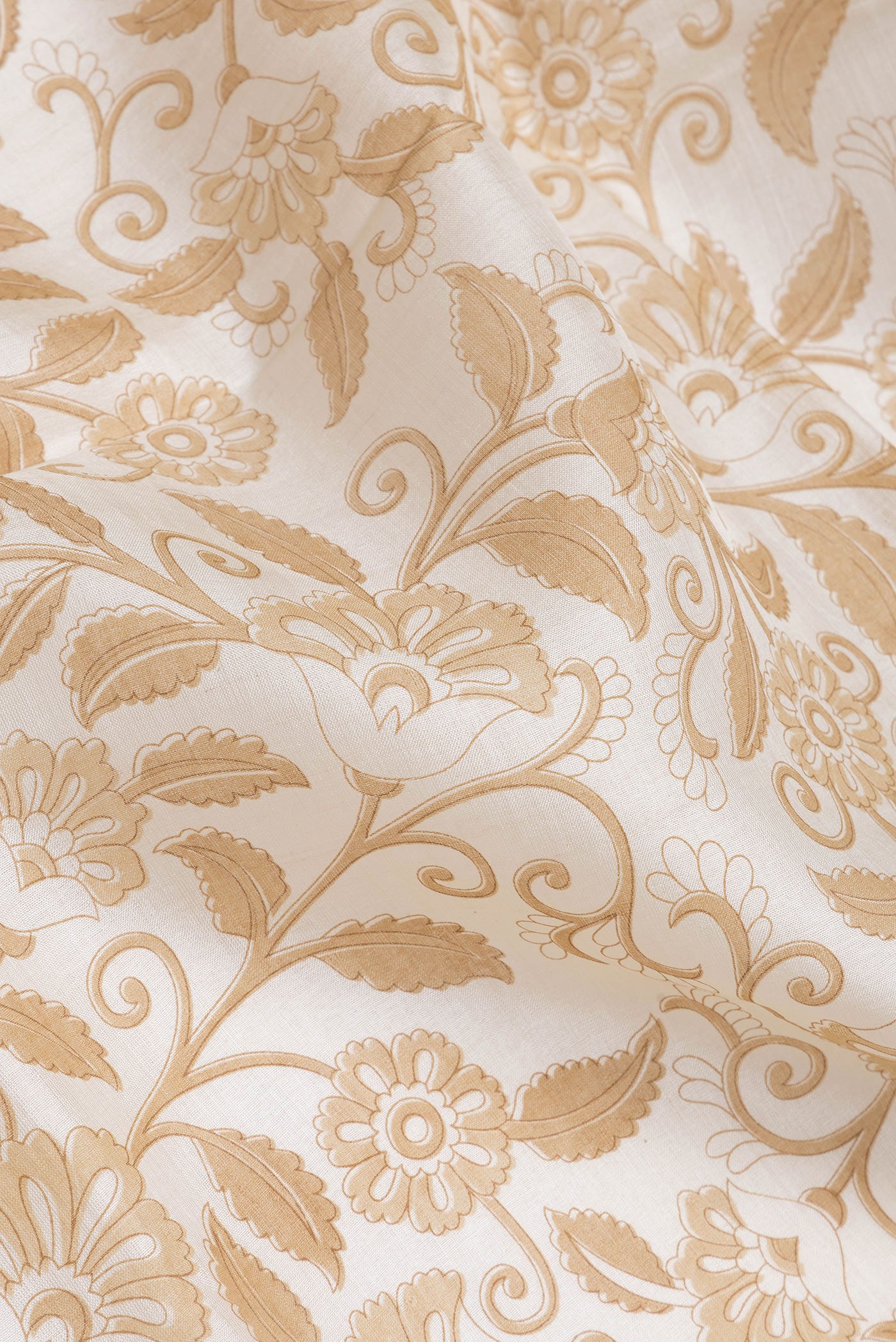 Close up of Off White Dual Tone Tussar Silk Saree with Printed design on the body and Zari Border.  displaying folds