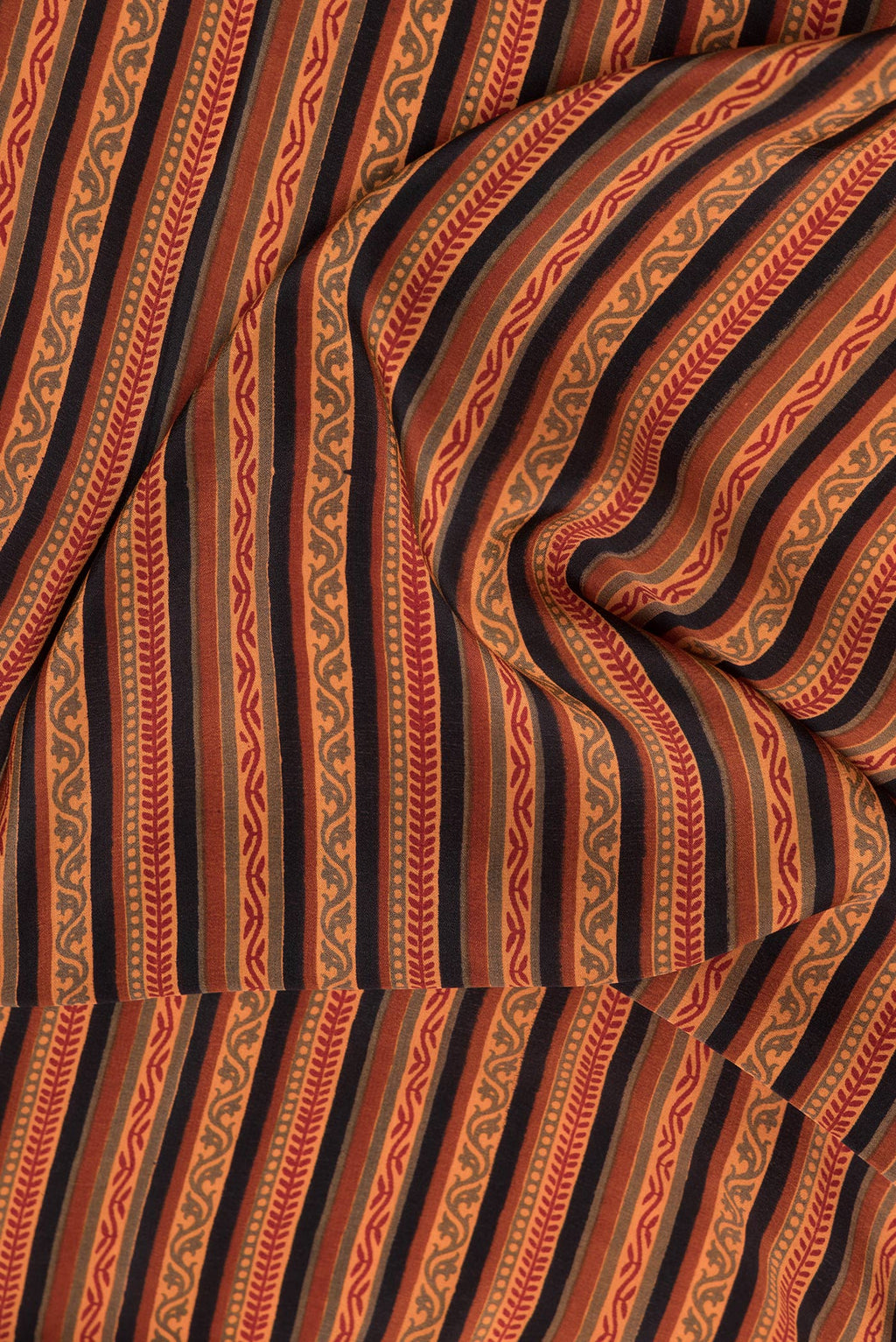Close up of Black Dual Tone Crepe Saree with Printed design on the body and Printed Border.  displaying folds