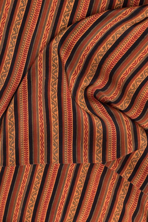 Close up of Black Dual Tone Crepe Saree with Printed design on the body and Printed Border.  displaying folds