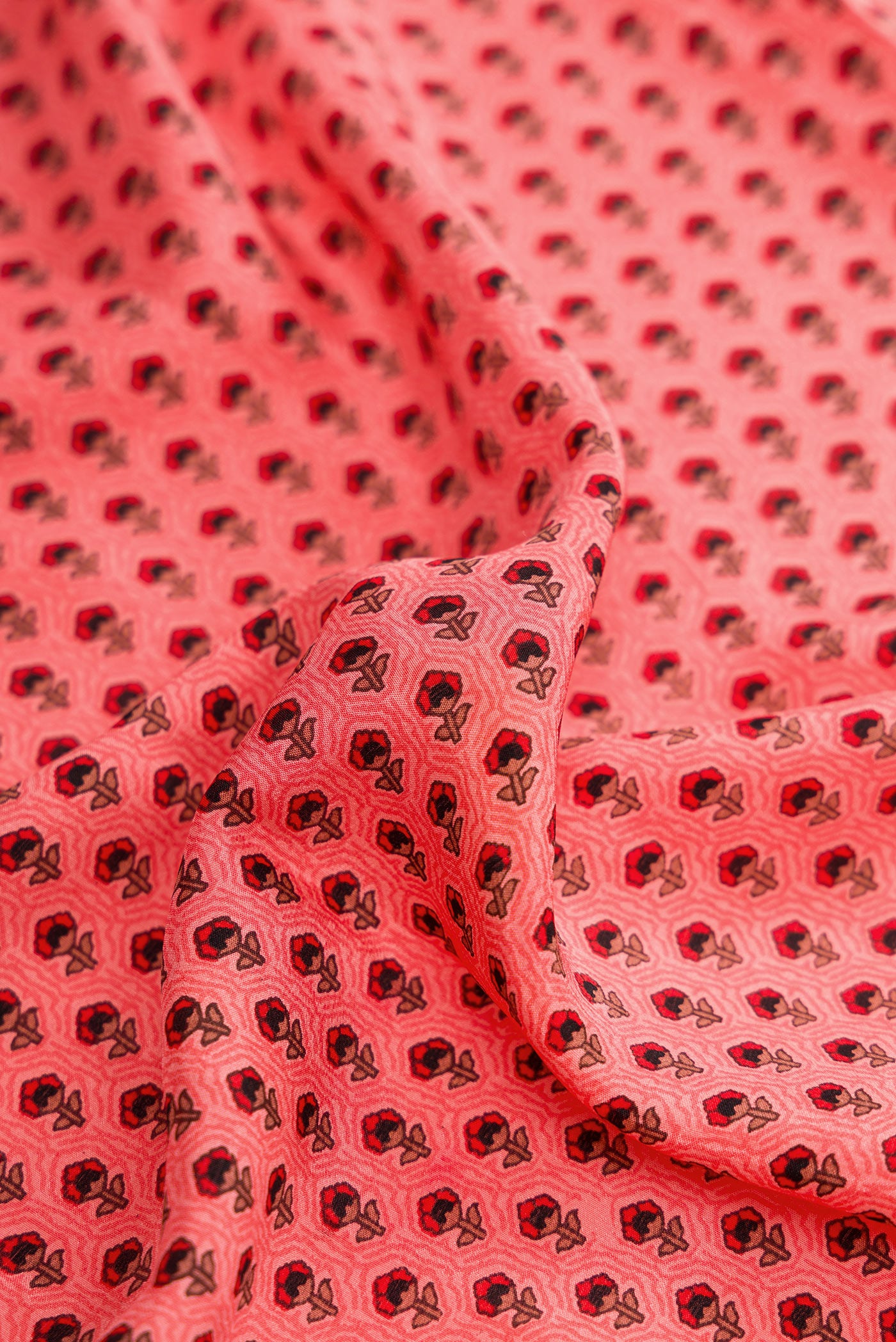 Close up of Pink Dual Tone Printed Silk Saree with Printed design on the body and Plain Border.  displaying folds