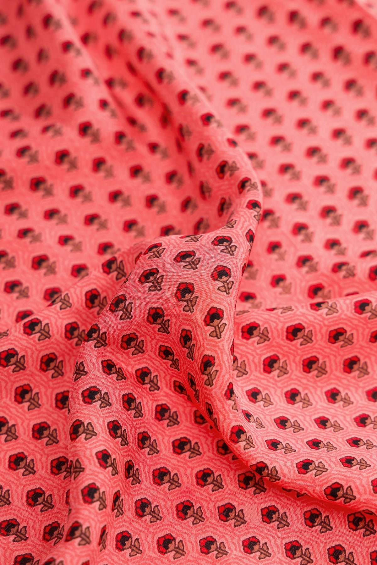 Close up of Pink Dual Tone Printed Silk Saree with Printed design on the body and Plain Border.  displaying folds
