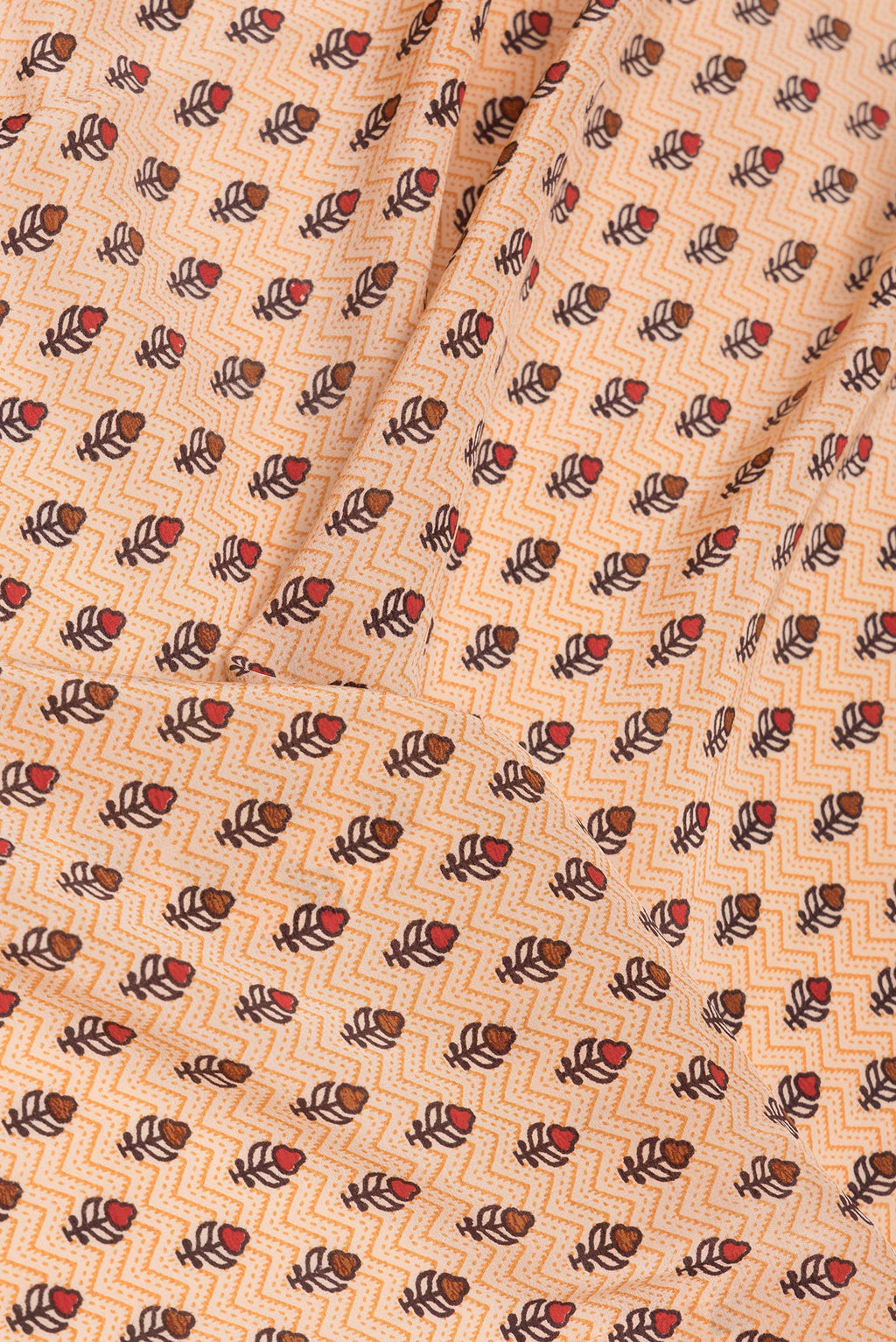 Close up of Sandal Dual Tone Crepe Saree with Printed design on the body and Printed Border.  displaying folds