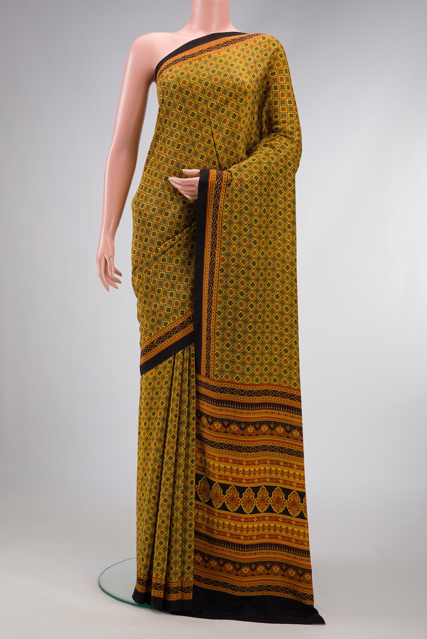 Mustard Dual Tone Printed Silk Saree with Printed design on the body and Plain Border.  displayed on a mannequin