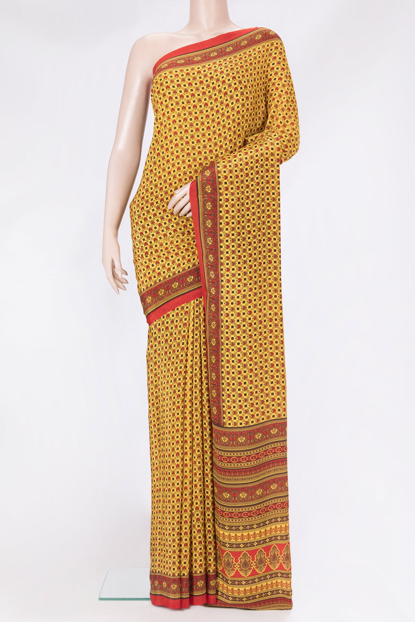 Yellow Crepe Saree with Printed design on the body and Printed Border.  displayed on a mannequin