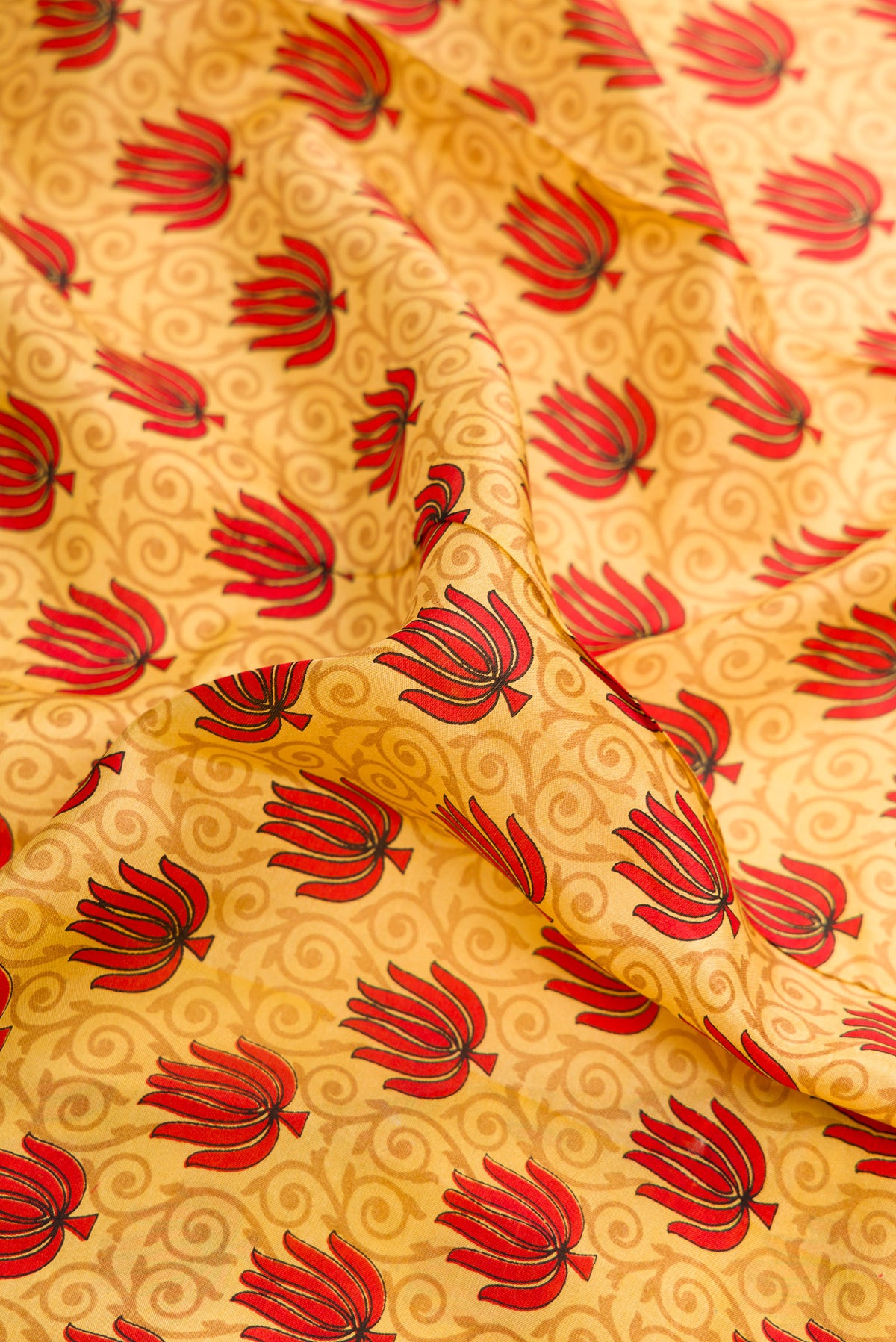 Close up of Sandal Dual Tone Mysore Crepe Saree with Printed design on the body and Printed Border.  displaying folds