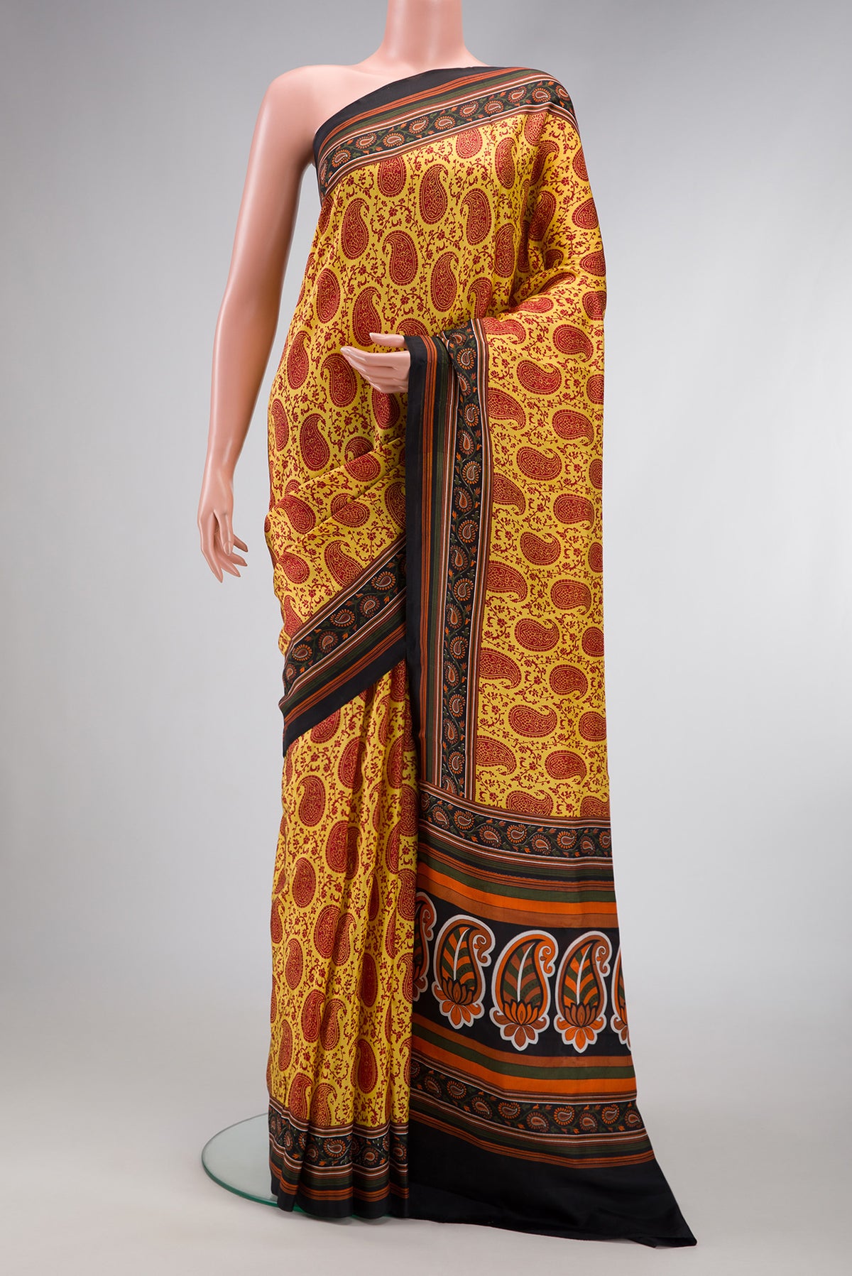 Yellow Dual Tone Printed Silk Saree with Printed design on the body and Printed Border.  displayed on a mannequin