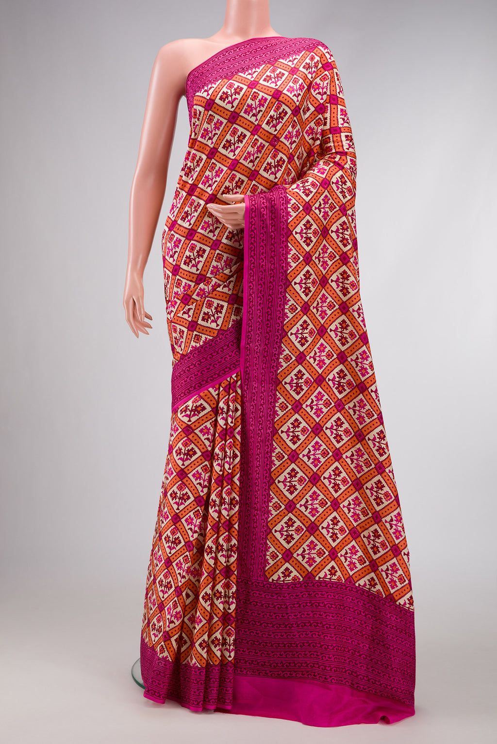 Sandal Dual Tone Mysore Crepe Saree with Printed design on the body and Printed Border.  displayed on a mannequin