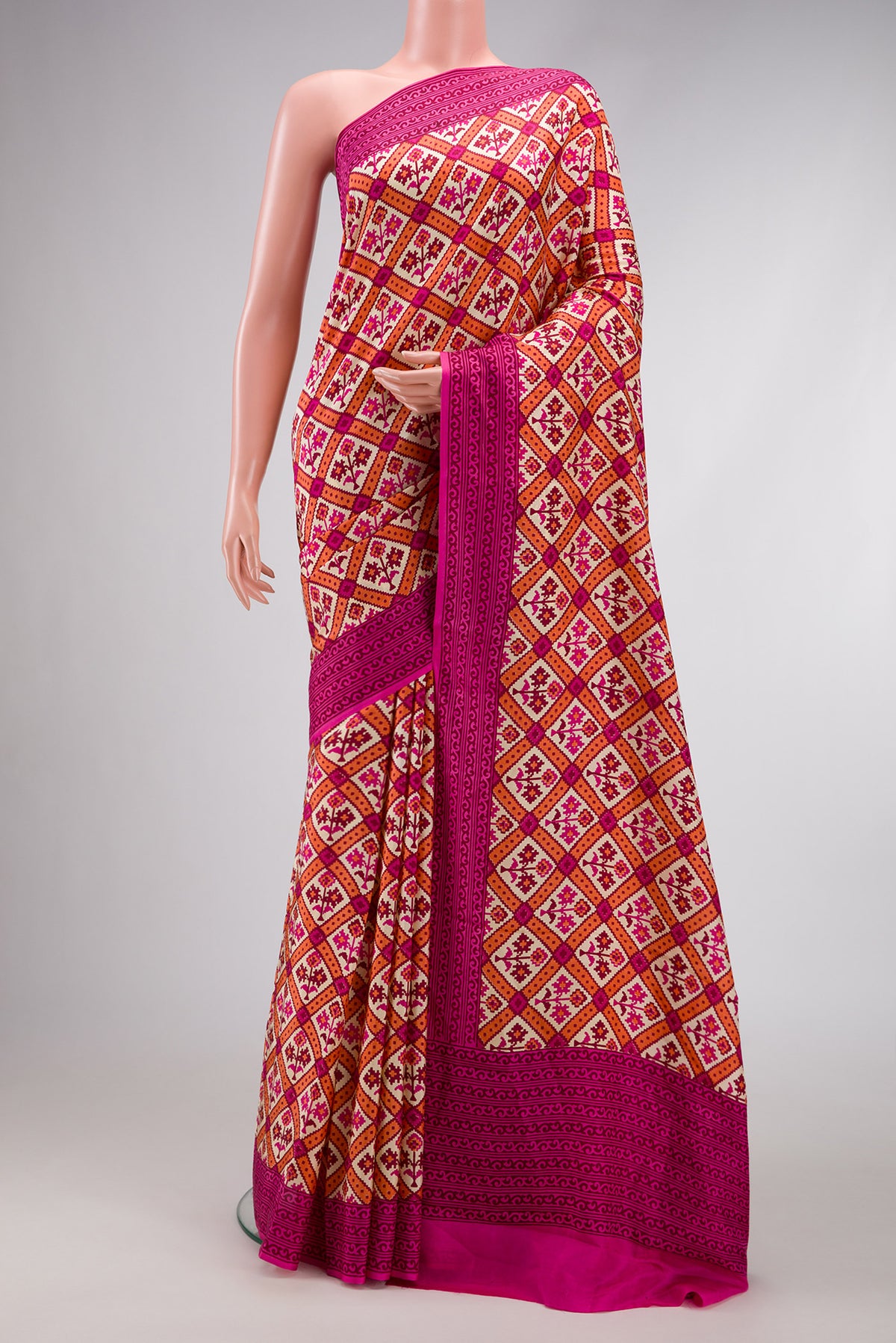 Sandal Dual Tone Mysore Crepe Saree with Printed design on the body and Printed Border.  displayed on a mannequin