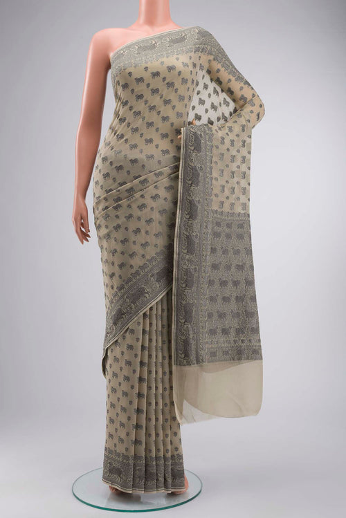 Beige Banarasi Georgette Saree with Zari Butta on the body and Zari Border displayed on a mannequin