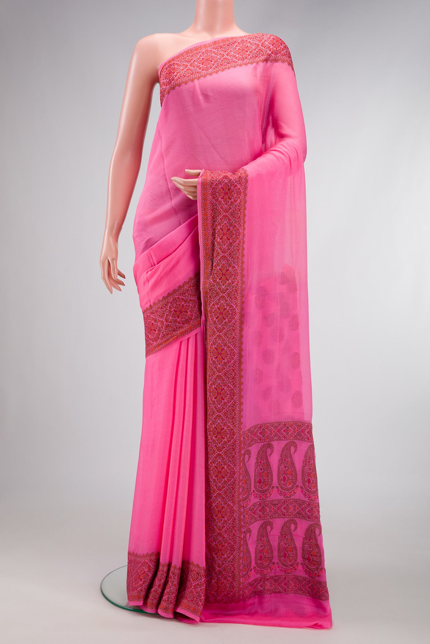 Pink Dual Tone Mysore Georgette Saree with Plain Body and Thread Border.  displayed on a mannequin