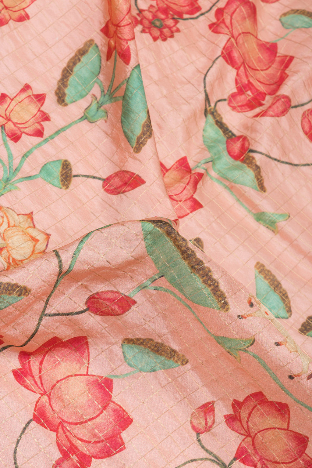 Close up of Rose Gold Dual Tone Kanjivaram Silk Saree with Checked design on the body and Zari Border.  displaying folds