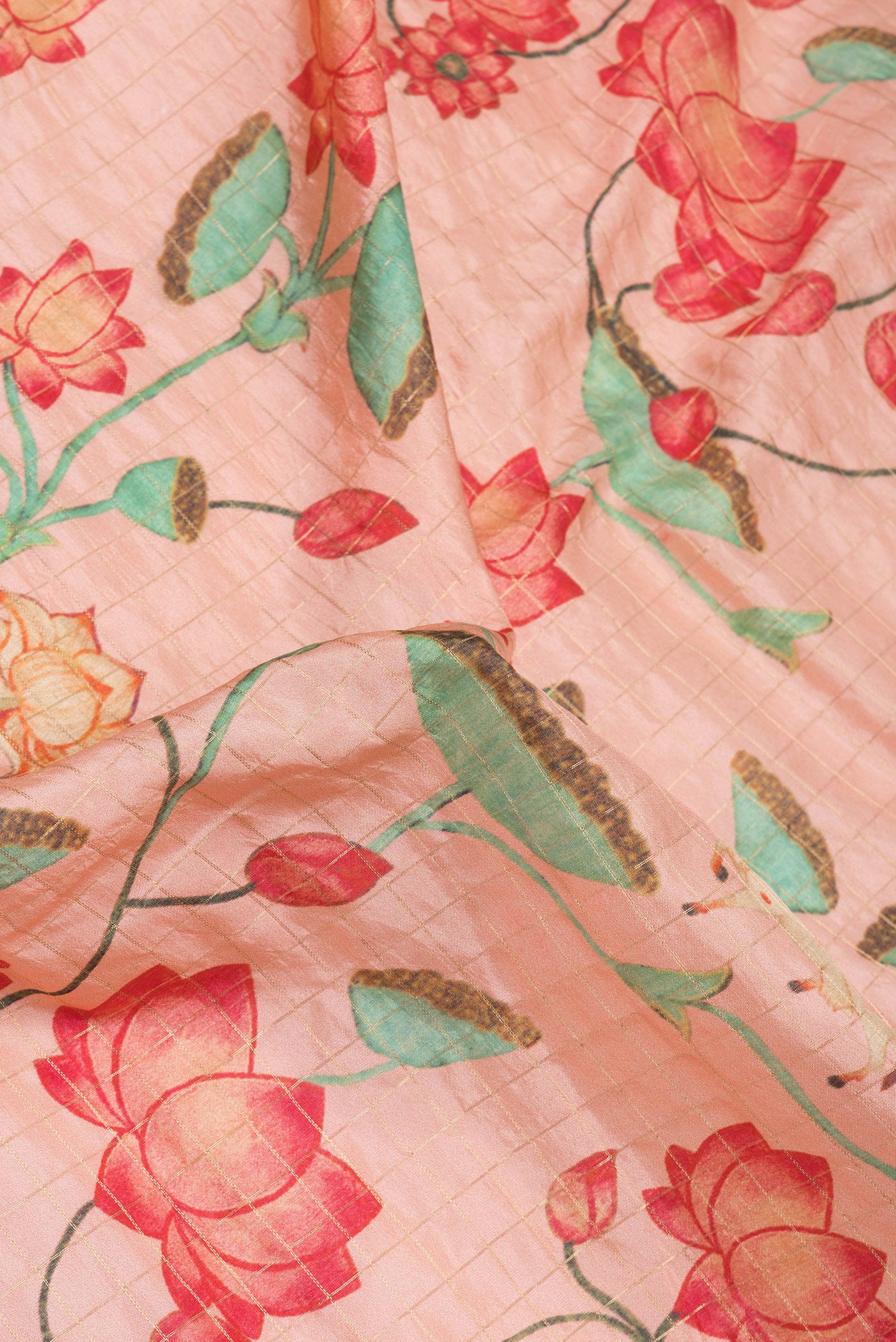 Close up of Rose Gold Dual Tone Kanjivaram Silk Saree with Checked design on the body and Zari Border.  displaying folds