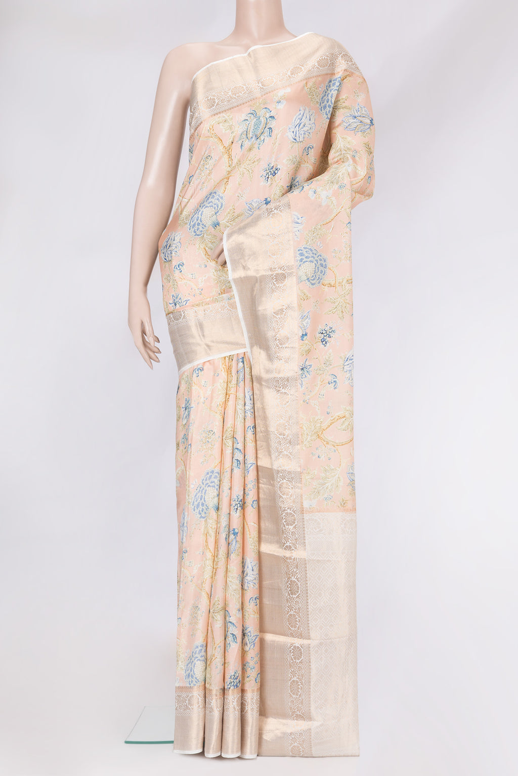 Peach Dual Tone Kanchipuram Silk Saree with Printed design on the body and Zari Border.  displayed on a mannequin