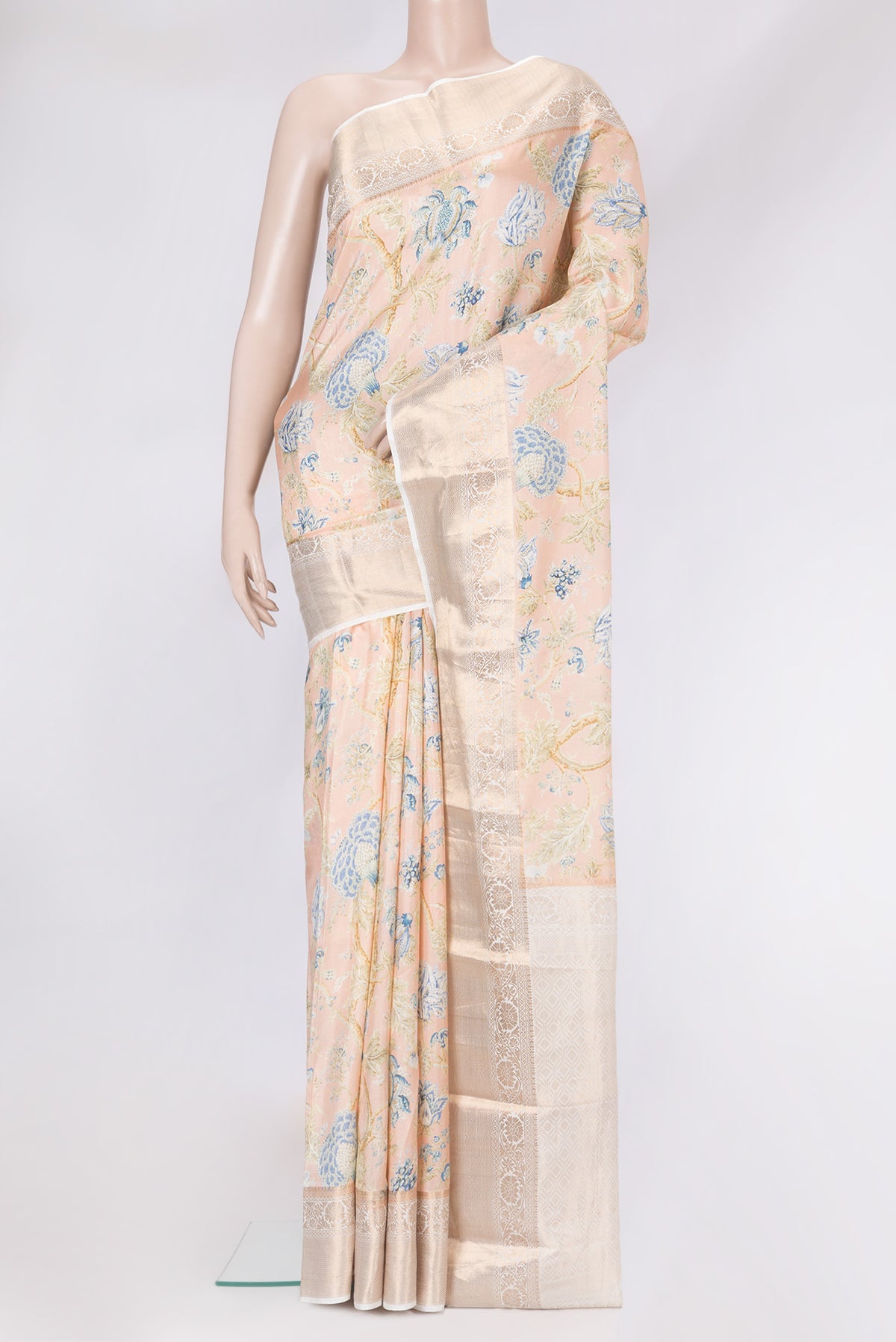 Peach Dual Tone Kanchipuram Silk Saree with Printed design on the body and Zari Border.  displayed on a mannequin