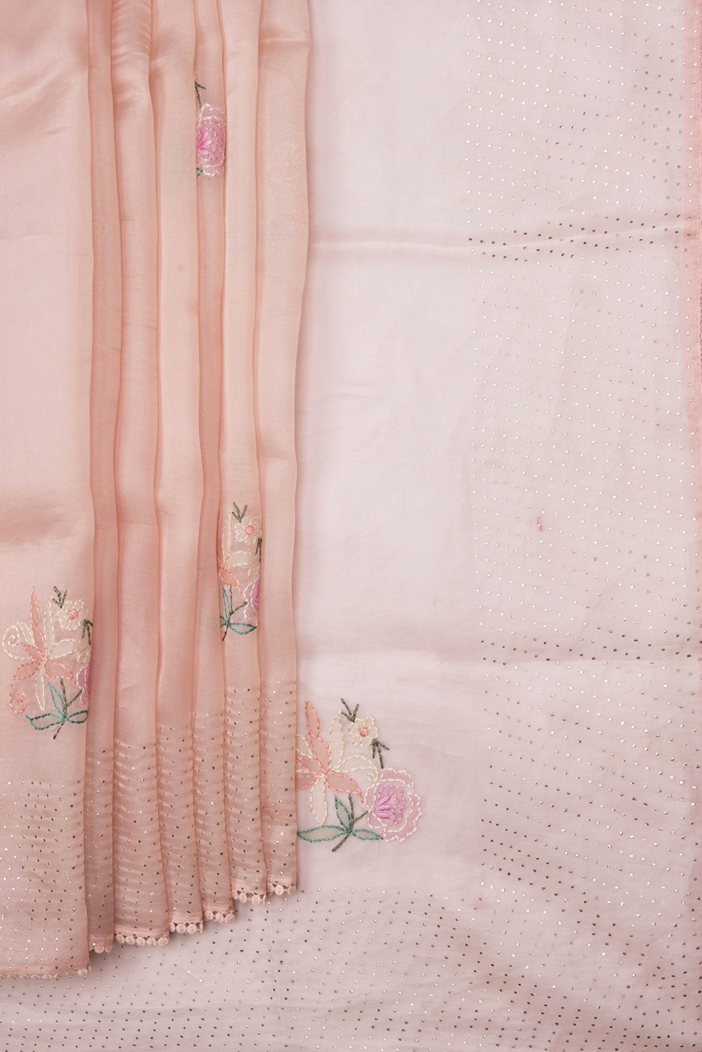 Pleats and pallu of Peach Dual Tone Organza Silk Saree with Embroidery on the body and Embroidery Border. 