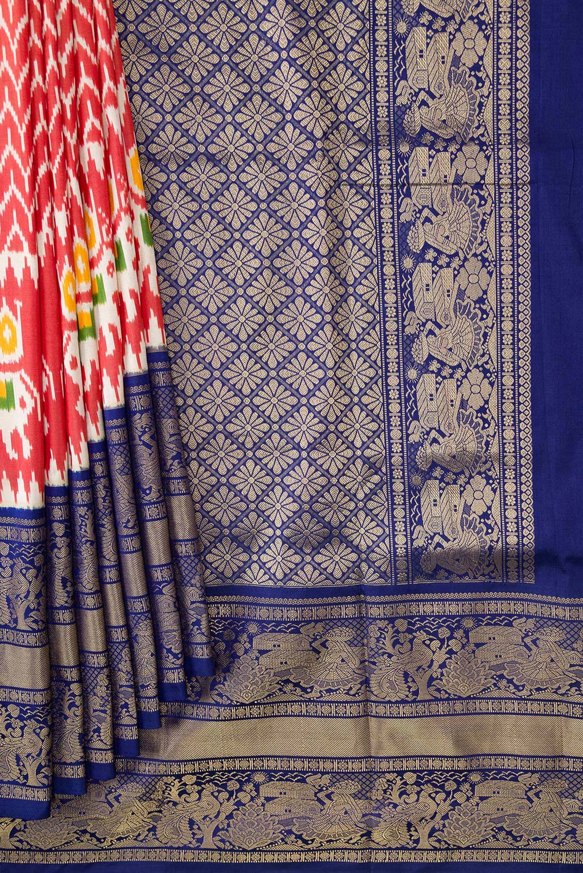 Pleats and pallu of Maroon Dual Tone Double Ikat Saree with Ikat Print on the body and Zari Border. 