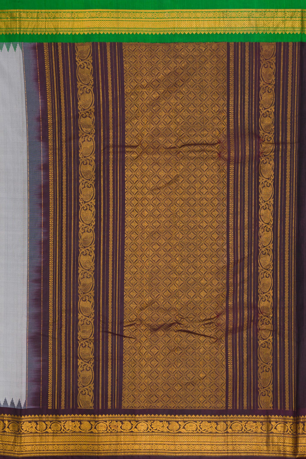 Close up image of the pallu of Grey Dual Tone Gadwal Silk Saree with Zari And Thread Butta on the body and Ganga Jamuna Border. 