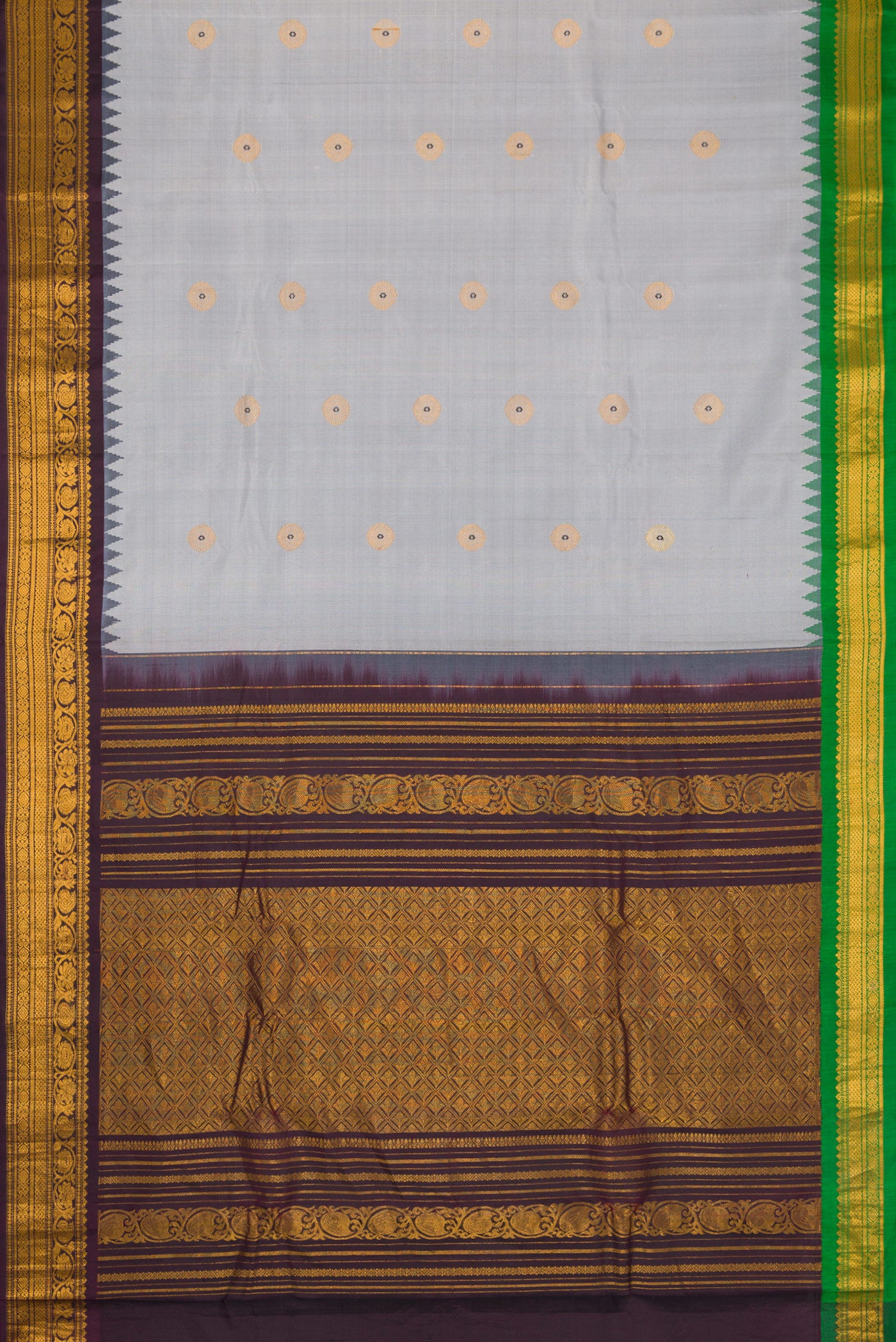 Flat view of Grey Dual Tone Gadwal Silk Saree with Zari And Thread Butta on the body and Ganga Jamuna Border. 