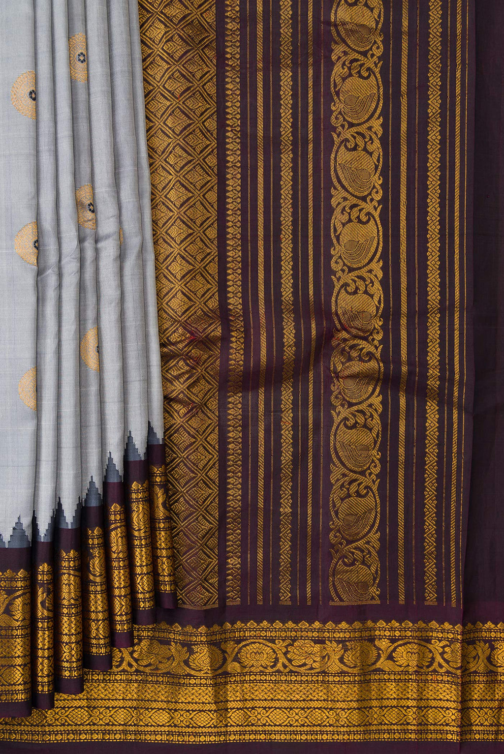 Pleats and pallu of Grey Dual Tone Gadwal Silk Saree with Zari And Thread Butta on the body and Ganga Jamuna Border. 