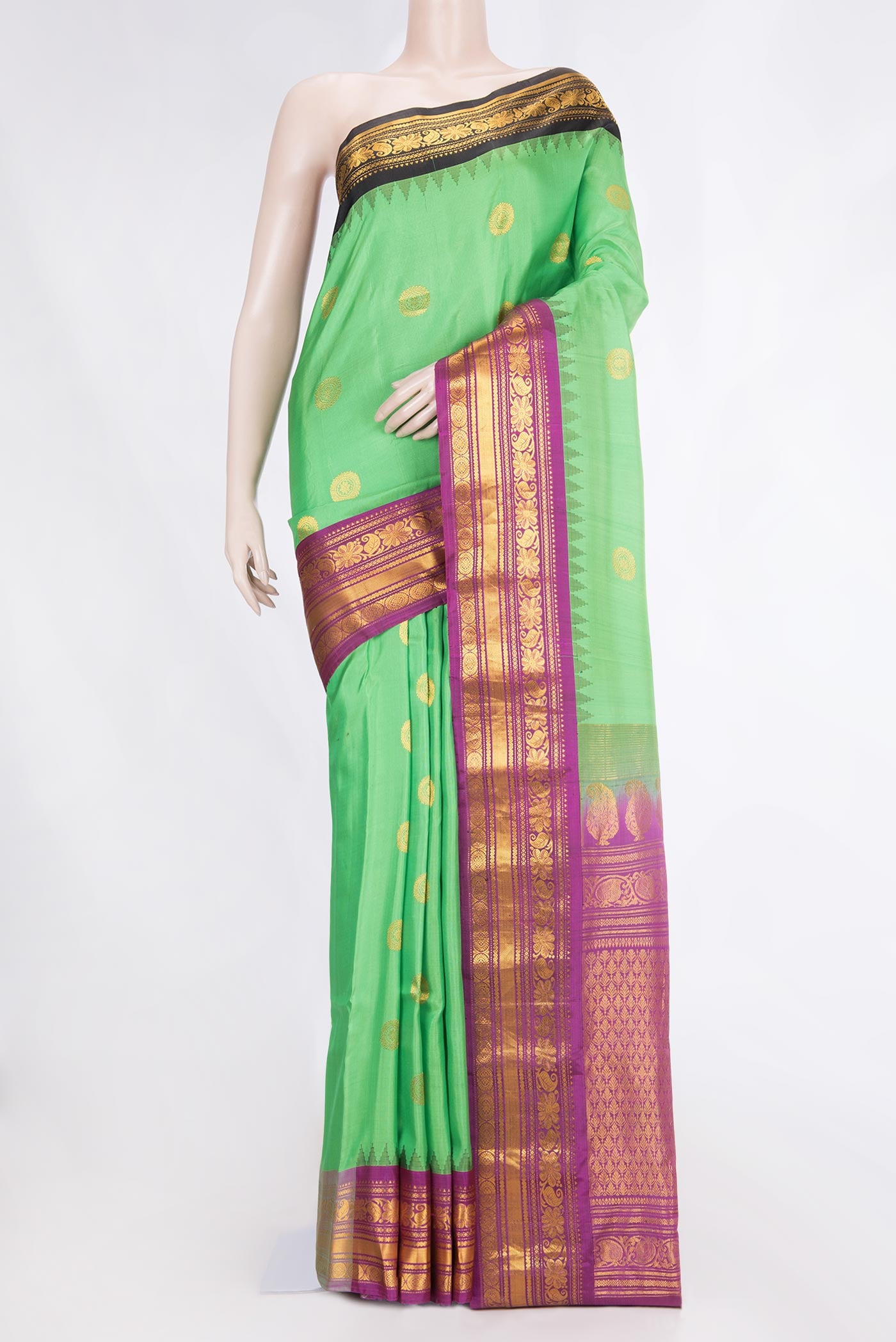 Parrot Green Dual Tone Gadwal Silk Saree with Zari Butta on the body and Ganga Jamuna Border displayed on a mannequin